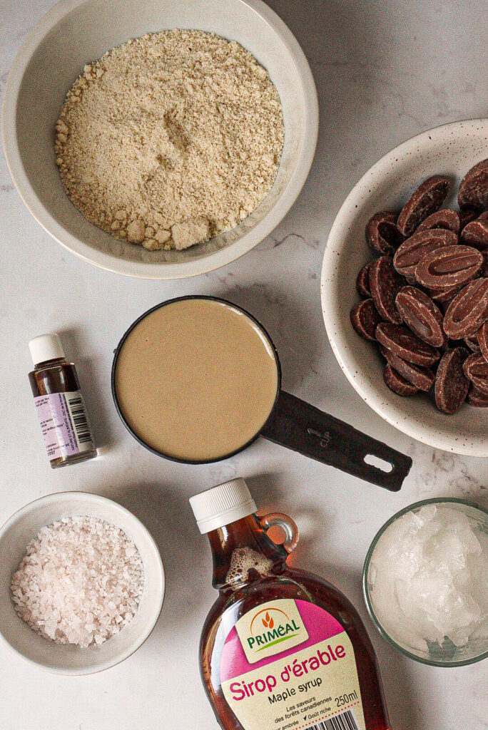 Fresh ingredients for making my homemade millionaire shortbread, including almond flour, coconut oil, chocolate, and caramel.