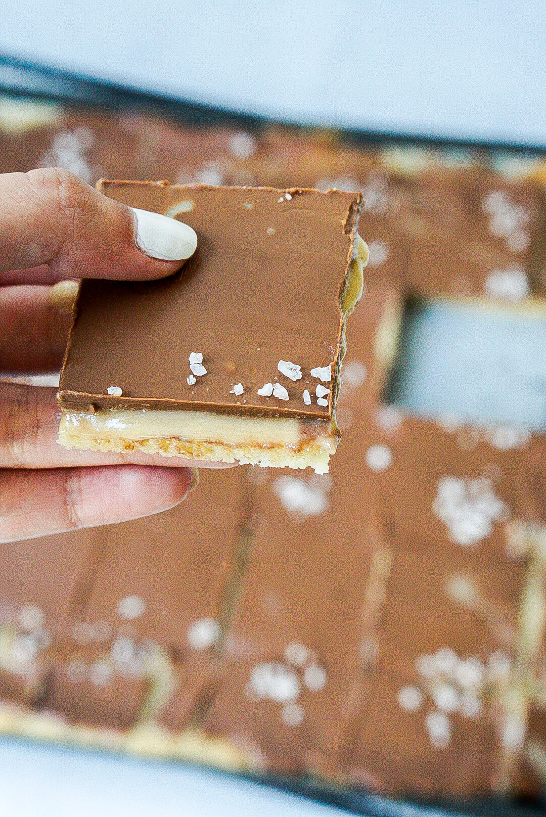 Delicious homemade millionaire shortbread with a layer of caramel and chocolate topping.